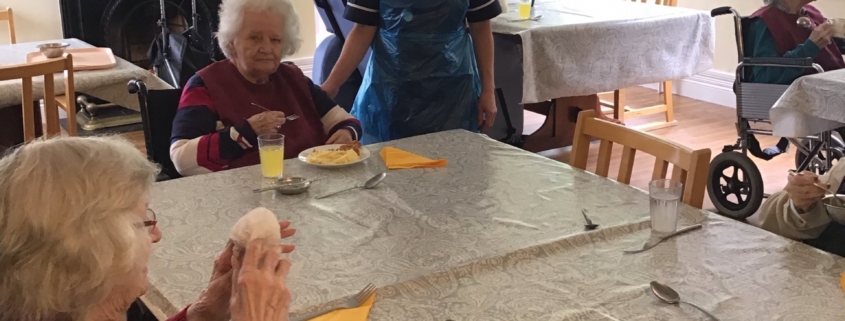 staff and residents eating